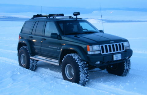 Forestgreen Grand Cherokee on 38 inch Radial Monster Mudder tires