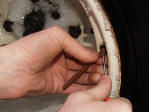 Plug the tire with a repair strand