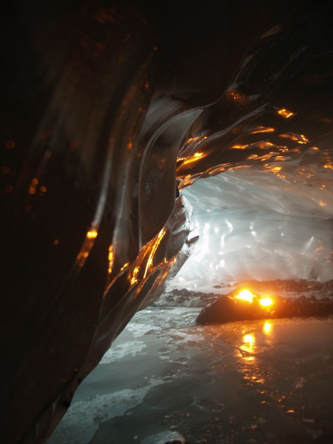 The inside of the ice cave is made magical by the natural light in addition to the torch lights.
