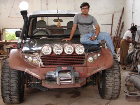 Mahindra Scorpio SUV From India Proud owner Kishan sitting on his truck