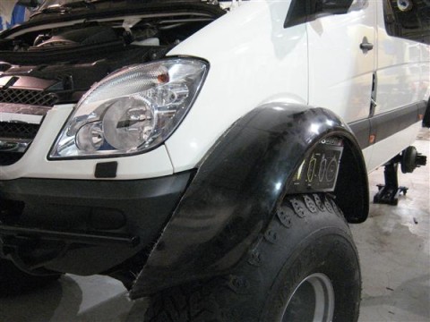 The fender flares are Mitsubishi Pajero 44 inch and don't seem to need that much modification to fit nicely.