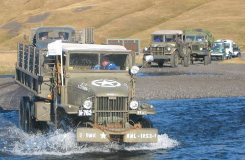 Old Army Trucks Crossing First River