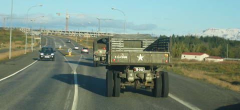 Old Army Trucks getting out of town