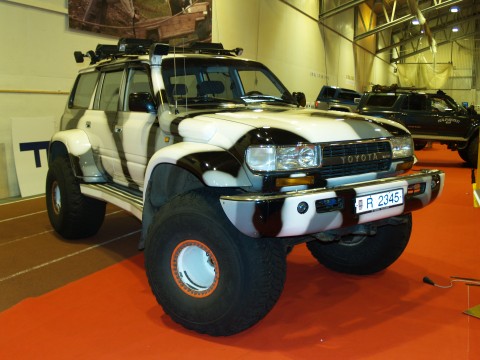 Toyota Land Cruiser on 44 inch tires and in ice and snow colored camo
