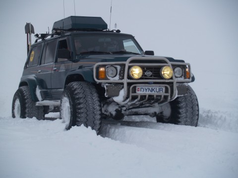 Older model Nissan Patrol on 44 inch tires.