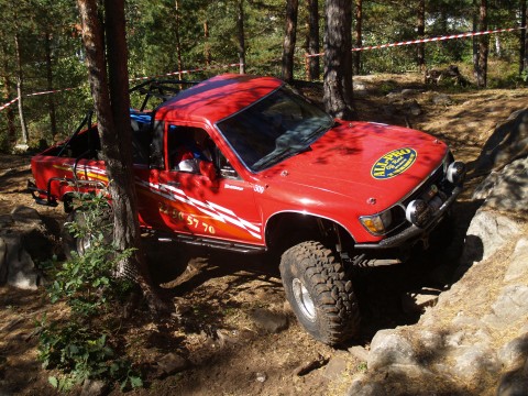 Ferrari shining red Toyota Hilux