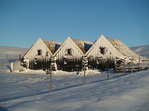 House made mostly of rocks and earth.