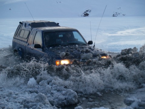 Halldor gets a wave of ice bergs up on the hood...